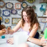 Student participant in pottery workshop while studying abroad in Spain