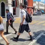 Students walking across street in downtown Merida 