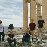Students standing at the ruins