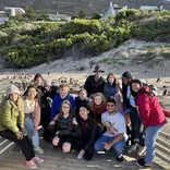 Students posing on beach in Cape Town