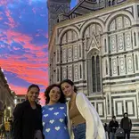 Students pose in front of the Duomo at sunset in Florence, Italy.