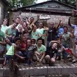 group of volunteers in front of building