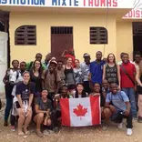 Group of volunteers in front of building