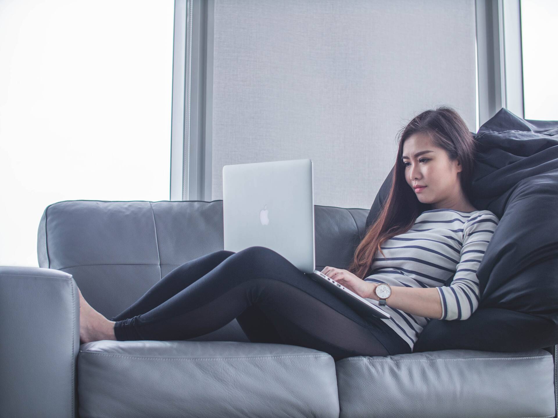 Girl on couch with computer