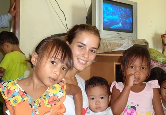 Volunteer in Cambodia and 3 babies