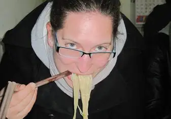Dominique eating noodles in Chengdu, 2011