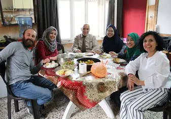 Having dinner together after learning how to cook 