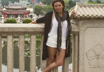 woman standing on bridge