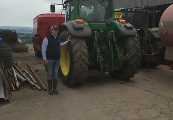 This is a image of myself and John Deere tractor that I got to work with on the same day of the dairy and learn different farming techniques