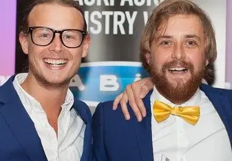 men in suits at award ceremony