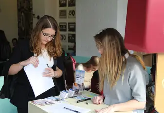 two women at reception desk