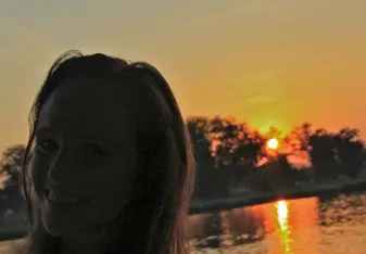 swimming at sunset in the River Kwai in Thailand