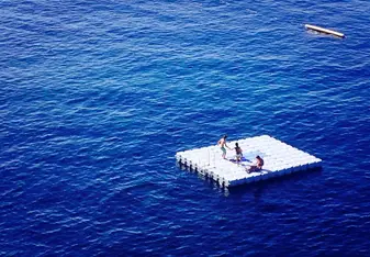 people on floating dock in ocean