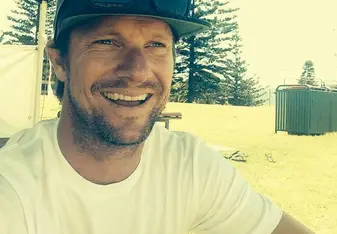 smiling man wearing hat