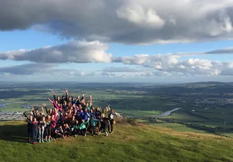 Students in Scottish landscape