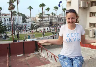 woman in city wearing c'est la vie shirt