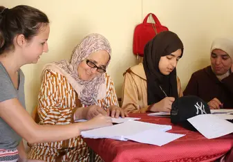 four women working at table