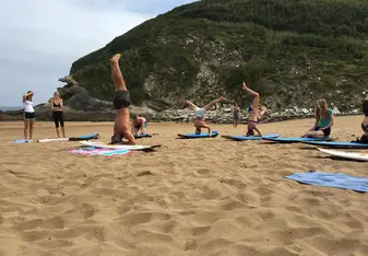 surf board yoga on beach