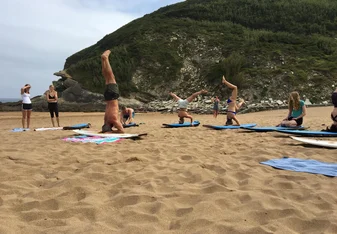 surf board yoga on beach