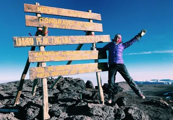 woman at Kilimanjaro summit