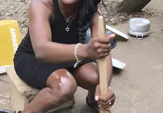 I came in from school and Mom insisted I try to turn the banku (like fufu, but the consistency is different. Banku is not my favorite). It was pretty hard trying to turn it. It takes some muscles! 