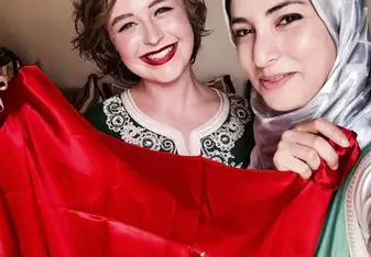 two women with Moroccan flag