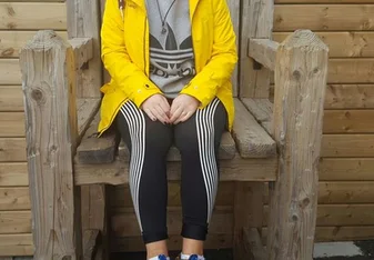 girl sitting on stone chair