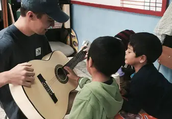 Teaching kids in Stage 3 how to play the Guitar