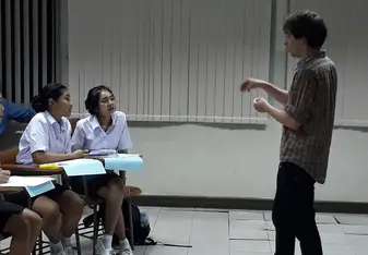 male teacher in classroom with students