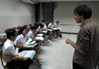male teacher in classroom with students