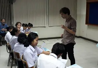 male teacher in classroom with students