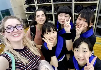 group photo showing peace sign