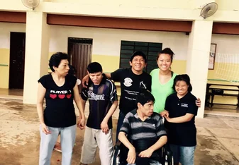 group photo of special needs residents and therapist