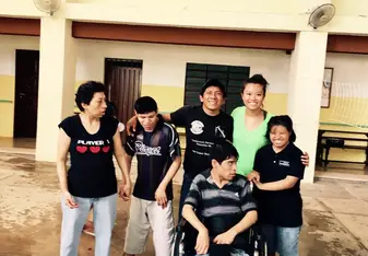 group photo of special needs residents and therapist