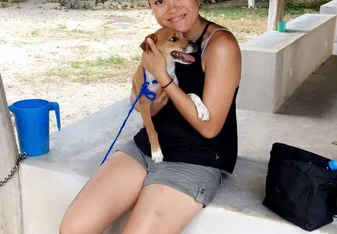 woman holding a dog