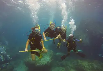 underwater group photo of divers