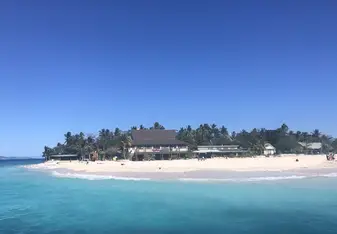 Beachcomber Island surrounded by crystal blue sea