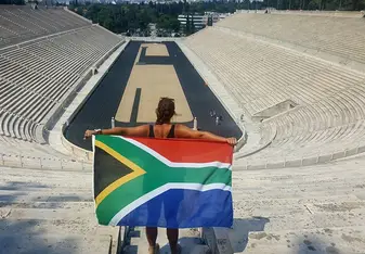 woman with South African flag in stadium