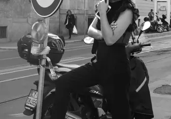black and white of girl and moped