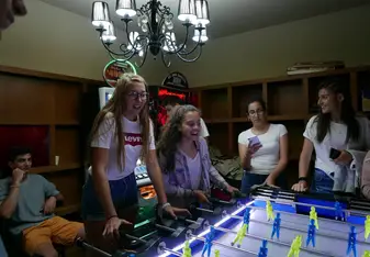 young girls playing table soccer