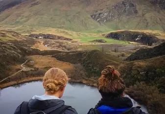 backpackers overlooking nature
