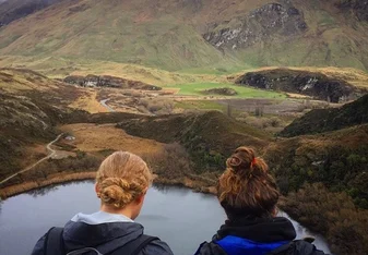 backpackers overlooking nature