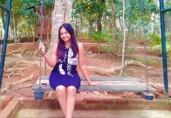 woman on swing in forest