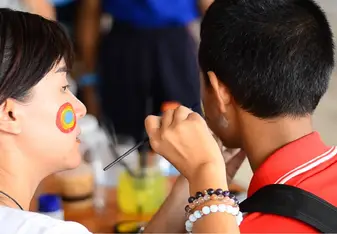 woman painting child's face