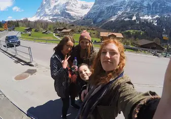 having lunch on the side of the Swiss Alps