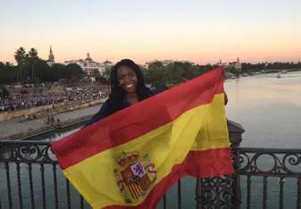 woman holding Spanish flag