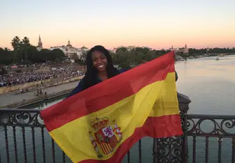 woman holding Spanish flag