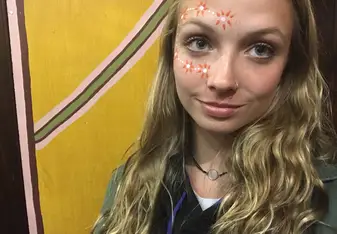 female headshot with face painting