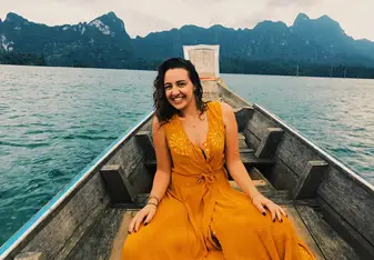 woman in yellow dress on boat