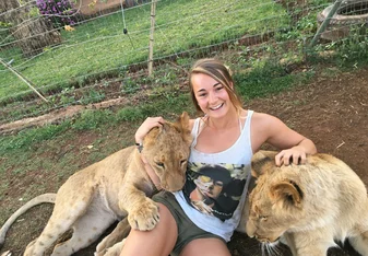 woman with lion cubs